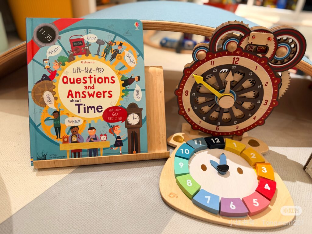 Hardcover interactive clock book with a wooden teaching clock toy for kids learning to tell time.